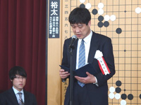文部科学省林大臣からの祝辞。代読は文部科学省　萬谷宏之 生涯学習政策局 生涯学習推進課長